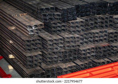 Metal Blanks For The Production Of Machinery In The Factory Warehouse. Square Tubing Pile In Factory Warehouse. Ferrous Metallurgy