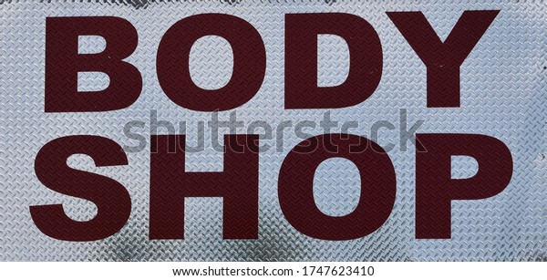 Metal Body Shop\
Sign With Red And White\
Text