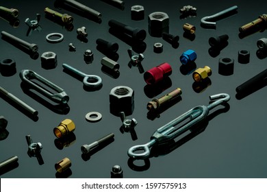 Metal Bolts, Nuts, And Washers. Fasteners Equipment. Hardware Tools. Different Types Of Nuts, Bolts, And Screws On Table In Workshop. Mechanic Tools. Threaded Fastener Use In Automotive Engineering.