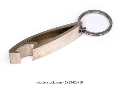 Metal Bottle Opener In The Form Of A Key Chain With Attached Steel Split Ring Close-up On A White Background
