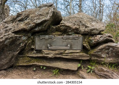 A Metal Box Embedded In Rock Holds The Trail Register On Top Of Springer Mountain In Georgia