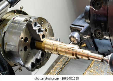 Metal Brass Workpiece Set On Spindle Chuck Of Automatic High Precision Cnc Lathe Turning 4 Axis Machine With Function Side Drill During Milling Groove By Cutting Tool In Industrial Manufacturing