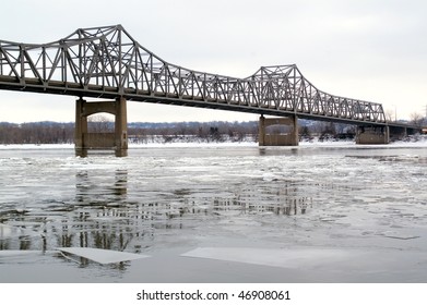 A metal bridge over the icy Illinois river in Peoria, IL