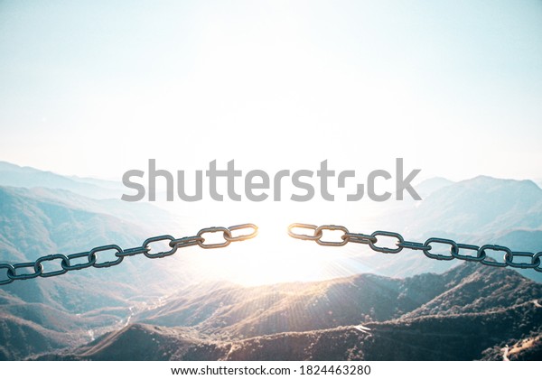 Metal broken chain on mountain background.\
Business and challenge\
concept.