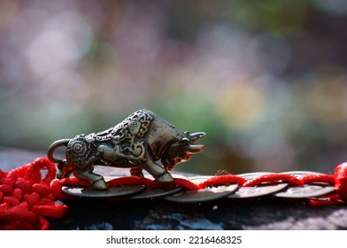 Metal Bull Figurine And Chinese Feng Shui Coins.