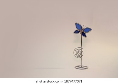 Metal Butterfly Card Holder On Clean Background