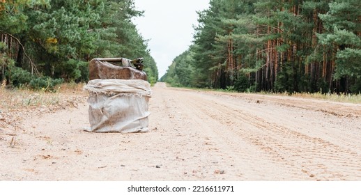 Metal Canister For Fuel On The Road In The Forest