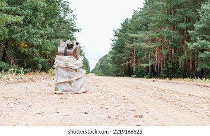 Metal Canister For Fuel On The Road In The Forest