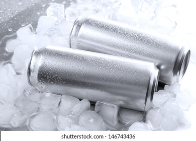 Metal Cans Of Beer With Ice Cubes, Close Up