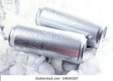 Metal Cans Of Beer With Ice Cubes, Close Up