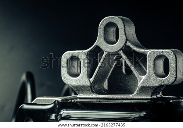 Metal car
engine spare part on black
background