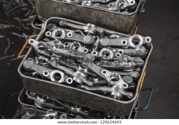 metal car spare\
parts in a mechanical work\
shop