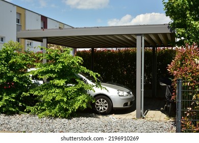 Metal Carport In Front Of A Residential Building