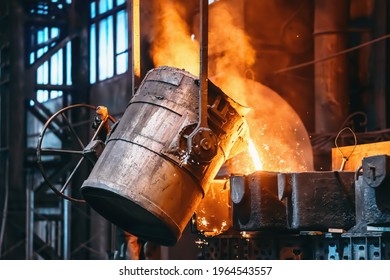 Metal casting process in foundry, liquid metal pouring from container to mold with clubs of steam and sparks, heavy metallurgy industry background - Powered by Shutterstock