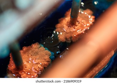 Metal cathodes covered with overgrowth copper powder - Shutterstock ID 2186909319