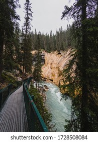 Metal Catwalk Running Alongside The Flowing Water In Johnston Canyon.