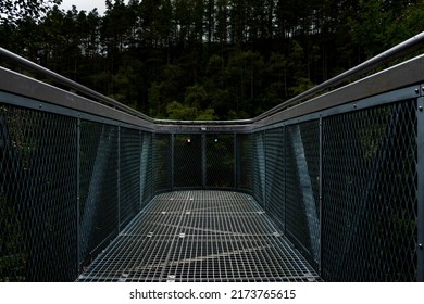 Metal Catwalk With Trees In Background