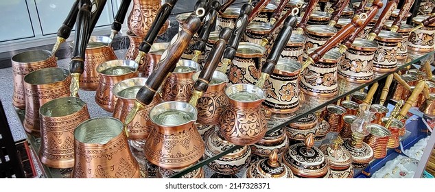 Metal cezves for turkish coffee and teapots in market