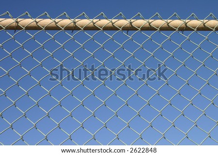 Metal chain link perimeter security fence.