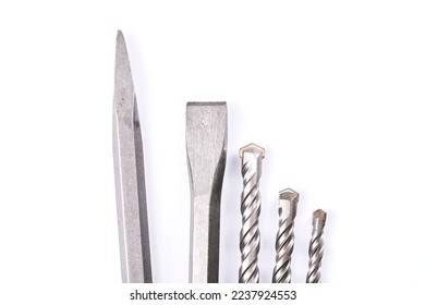 Metal chisel and drill bits on concrete for perforator isolated on white background
