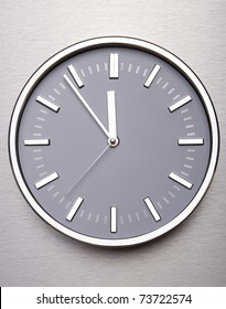 Metal Clock On The Wall Of Steel