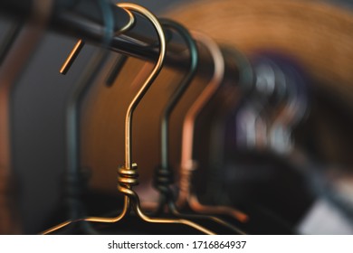 Metal Clothes Hanger, Warm Light, Close-up. Fashion Concept, Wardrobe.