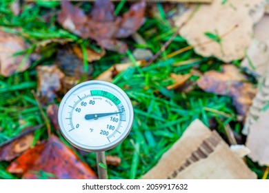 A Metal Compost Thermometer Inserted Into A Pile Of Composting Material. Nitrogen And Carbon Containing Mixture Of Leaves, Lawn Clippings And Cardboard Results In Hot Composting At High Temperature