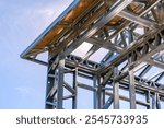 Metal construction detail on a residential structure. Construction site no body for background. Showcasing industrial construction elements.