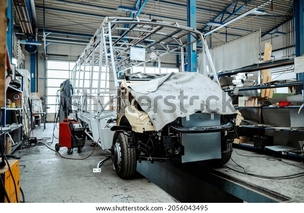 Metal construction for a new mini bus. Bus making
factory, vehicle factory
