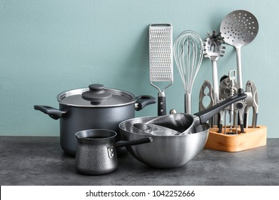 Metal cooking utensils on table - Shutterstock ID 1042252666