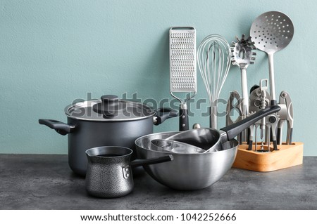 Metal cooking utensils on table