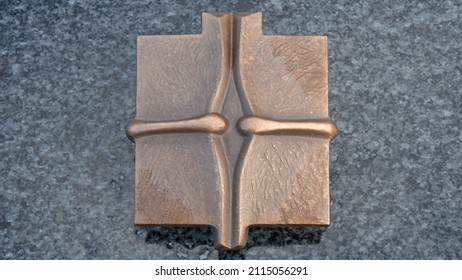 Metal Cross On Marble Tomb 