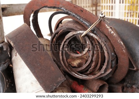 Metal cutoff rusty rings tied in bundle