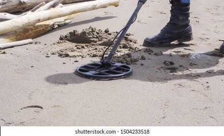 The Metal Detector Is A Close-up On A Sandy Beach. Search For Lost Jewelry And Phones.