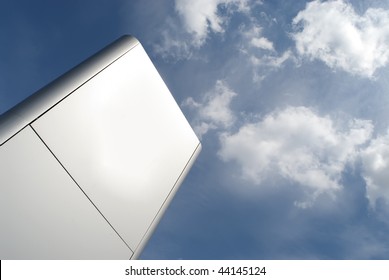 metal display totem against blue sky