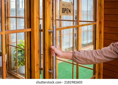 Metal Door Handle Decorated With Wood At The Cafe With Welcome And Open Sign.