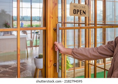 Metal Door Handle Decorated With Wood At The Cafe With Welcome And Open Sign.