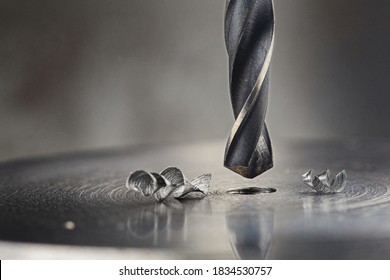 Metal Drill Bit Make Holes In Steel Billet On Industrial Drilling Machine. Metal Work Industry And Locksmith Work.