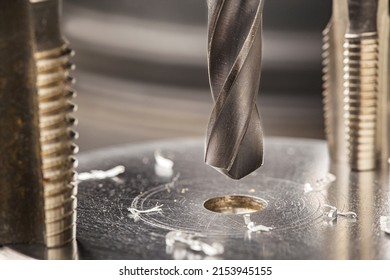 Metal Drill Bit Make Holes In Aluminum Billet On Industrial Drilling Machine With Shavings. Metal Work Industry. Multi Cutting Tool And End Mill.