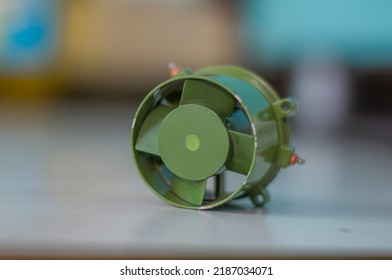 Metal electric motor with green impeller