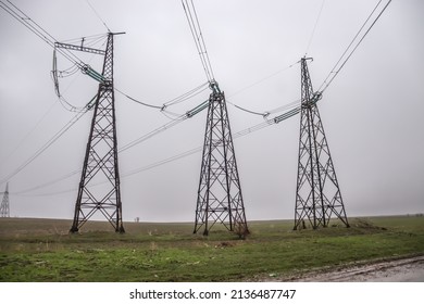 Metal electrical cable poles used in the field during rainy weather.