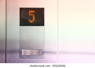 In Metal Elevator LCD Display Shows Number Of Fifth Floor.