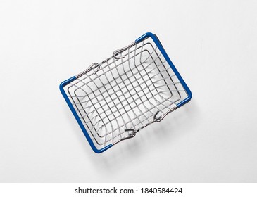 Metal Empty Shopping Basket Over White Background With Shadow, Top View.