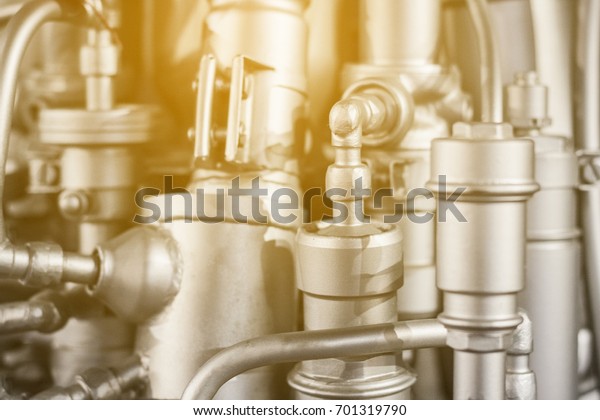 Metal\
engine background. Silver elements of\
engineering
