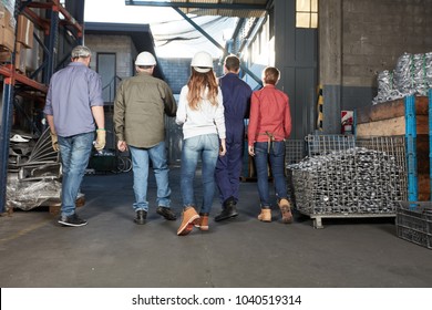 Metal factory group of metalworkers as a team - Shutterstock ID 1040519314