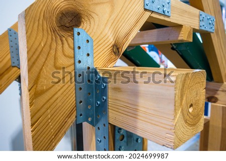 Metal fastening systems for wooden products.