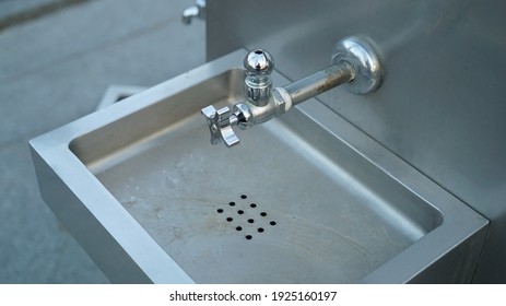 Metal Faucet For Drin Water In A Public Winter Park