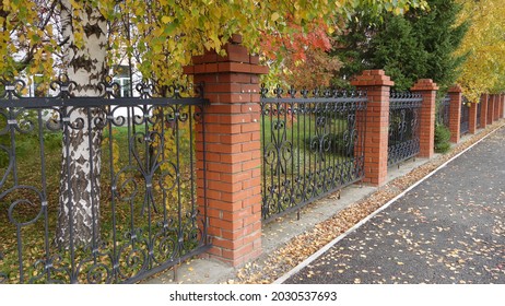 Metal Fence With Brick Posts