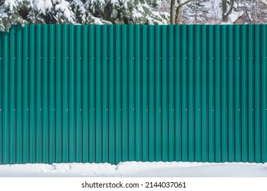 Metal Fence By The Private House At Winter Time.