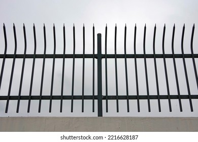 Metal Fence On A Rooftop Parking Structure